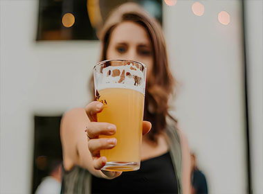 A girl with a beer